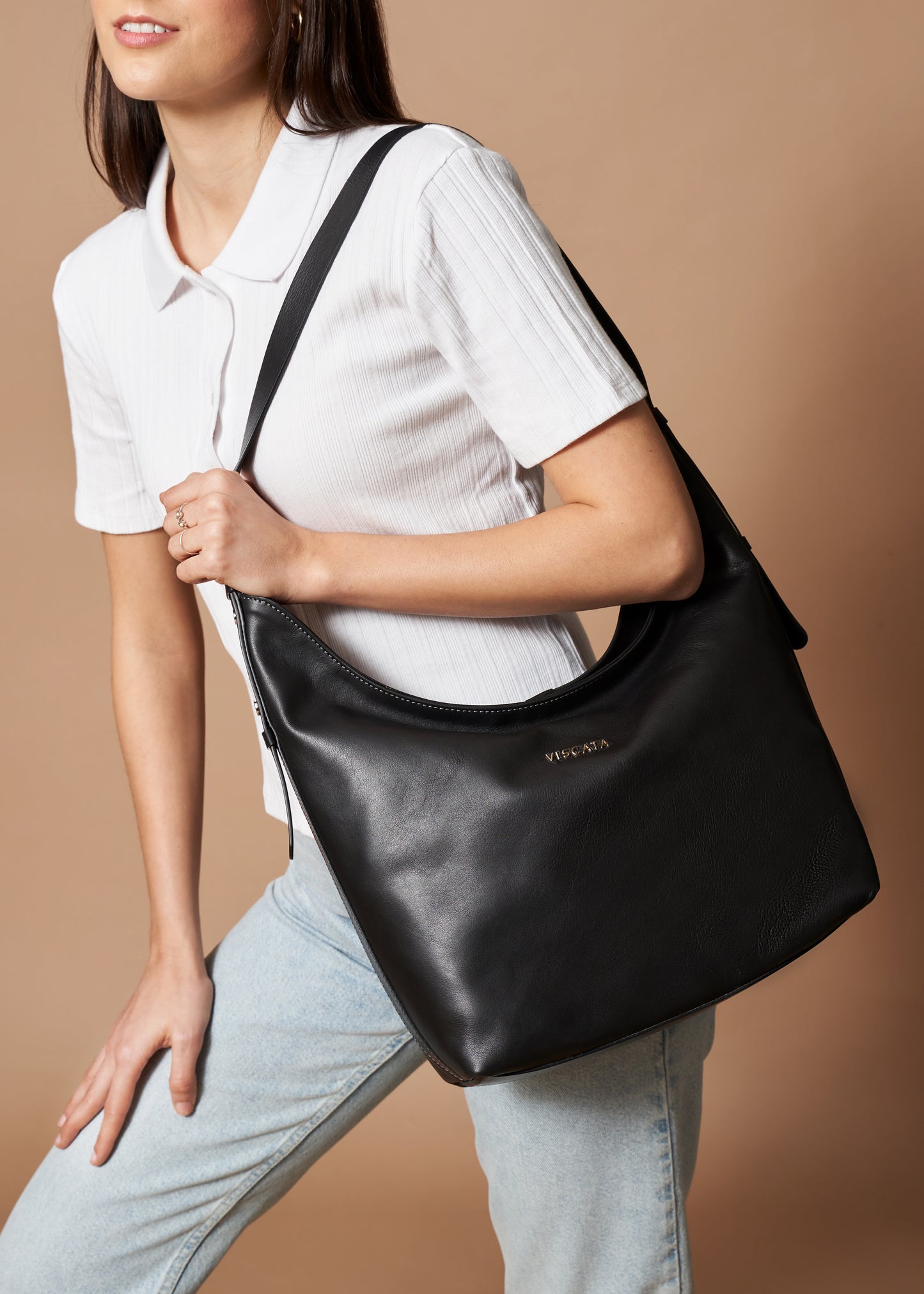 Woman Carrying a Cyprien Black Large Leather Shoulder Handbag