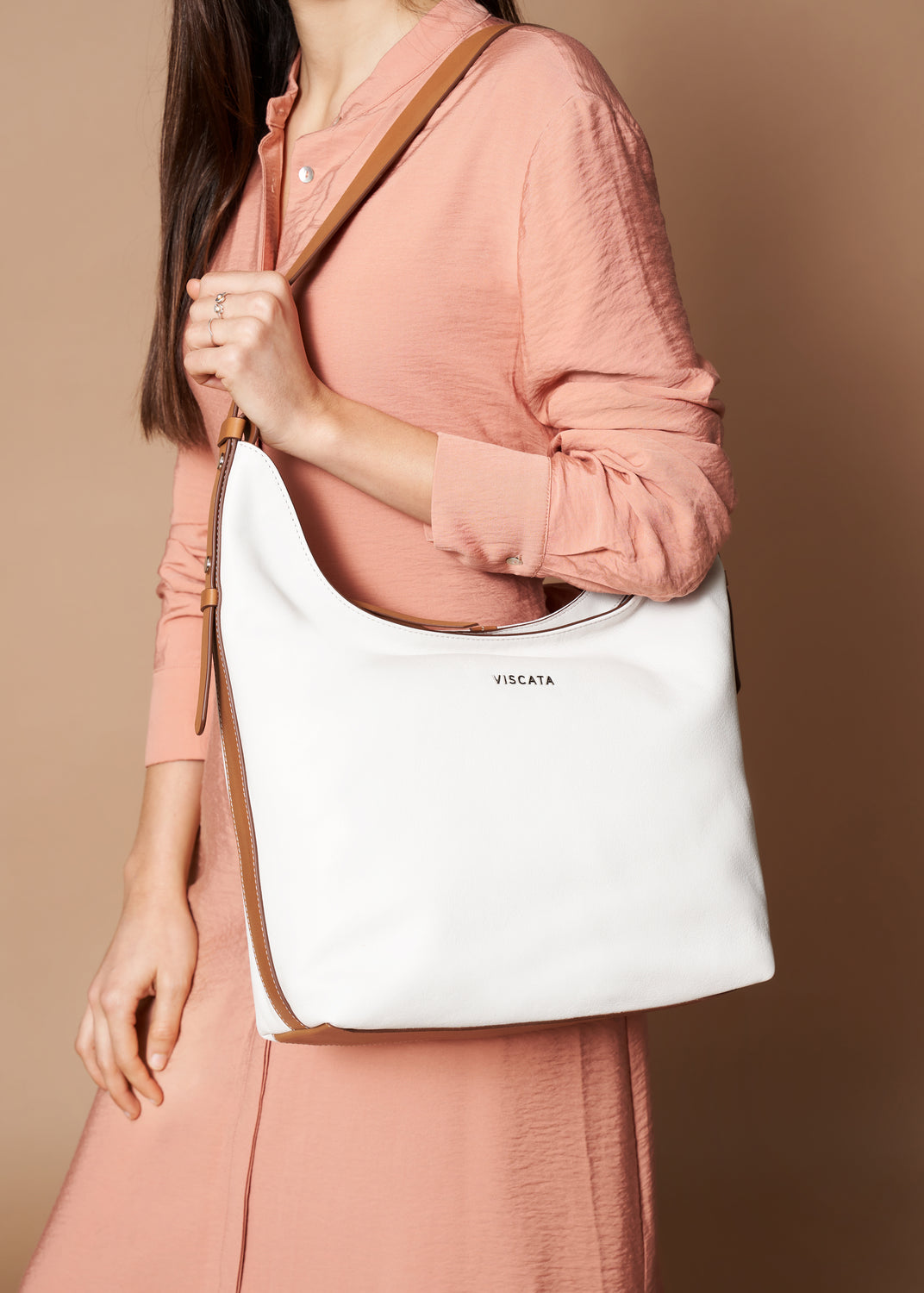 Woman Carrying a Cyprien Cream Large Leather Handbag