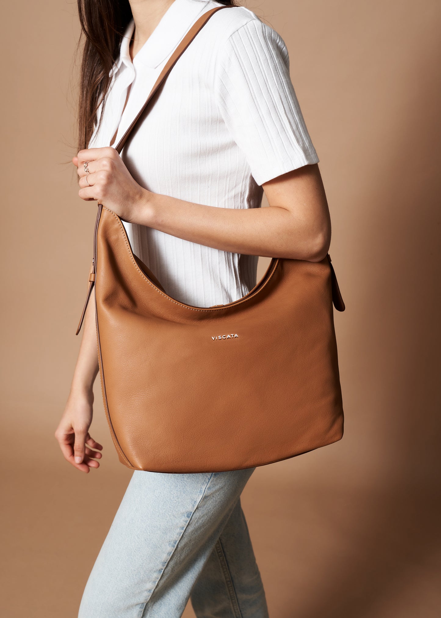 Woman Carrying Cyprien Whiskey Brown Large Leather Handbag